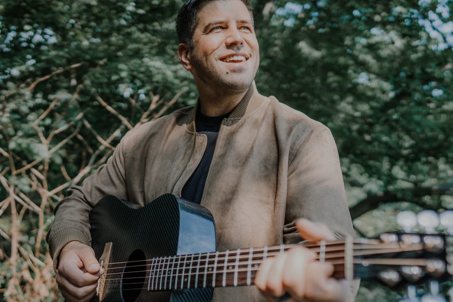 Bryce Larsen with guitar